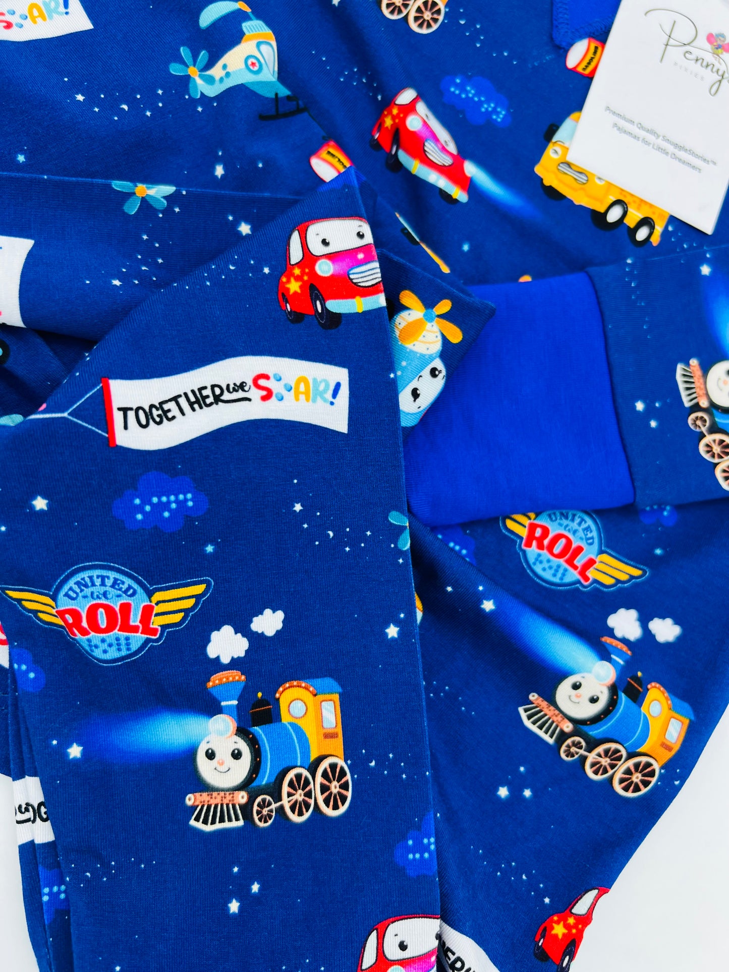 close up of Vehicles and transportation themed Child Pajamas with Braille on label.