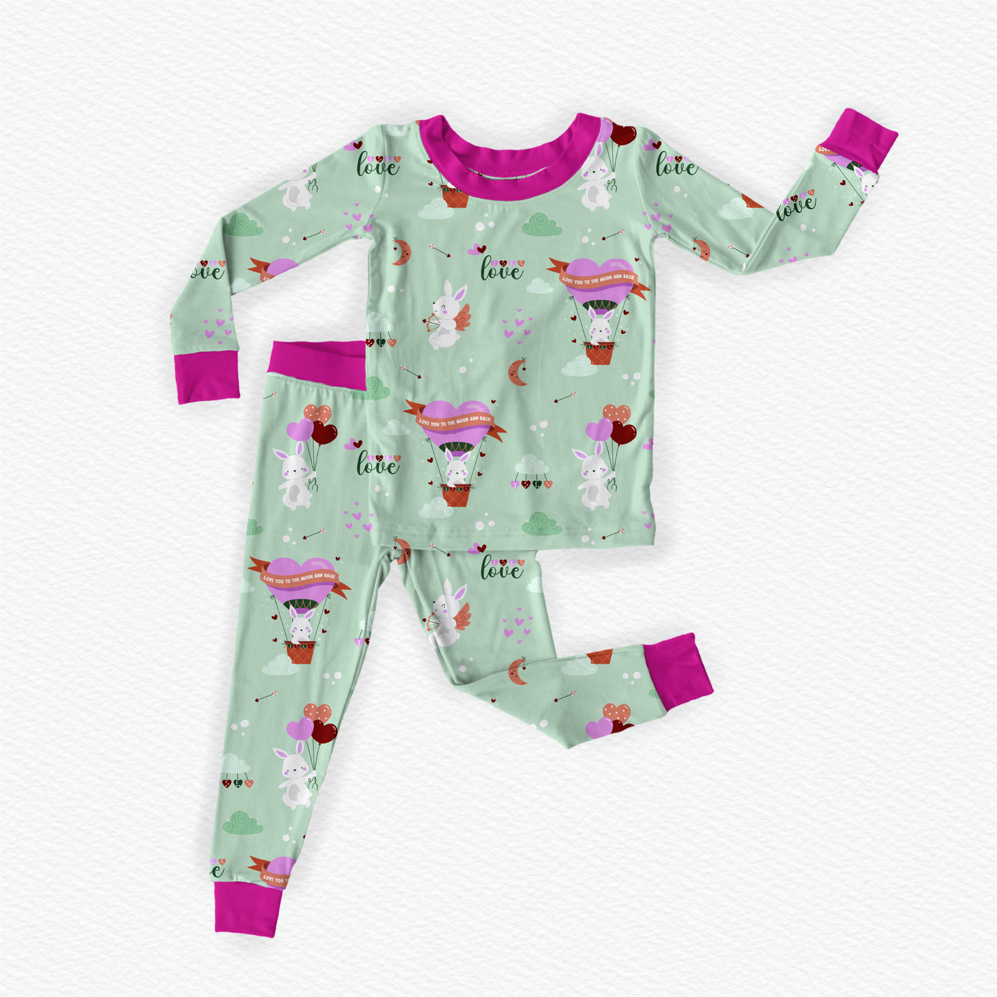 Green and Pink soft bamboo kids pajamas featuring Cupid the Bunny with braille labels.