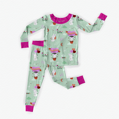 Green and Pink soft bamboo kids pajamas featuring Cupid the Bunny with braille labels.