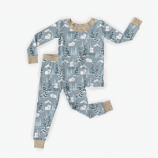 Gray bamboo kids pajamas featuring Benny the Bear in a winter wonderland with braille label