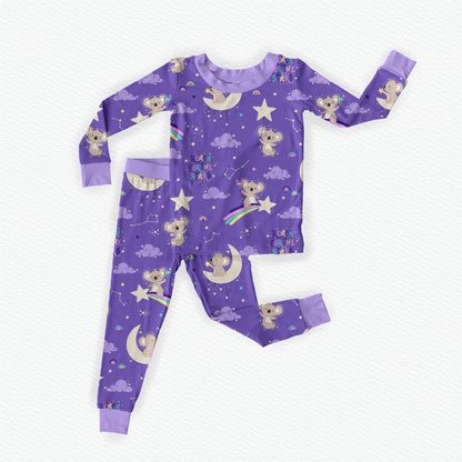 Purple bamboo kids pajamas featuring a Koala in space theme