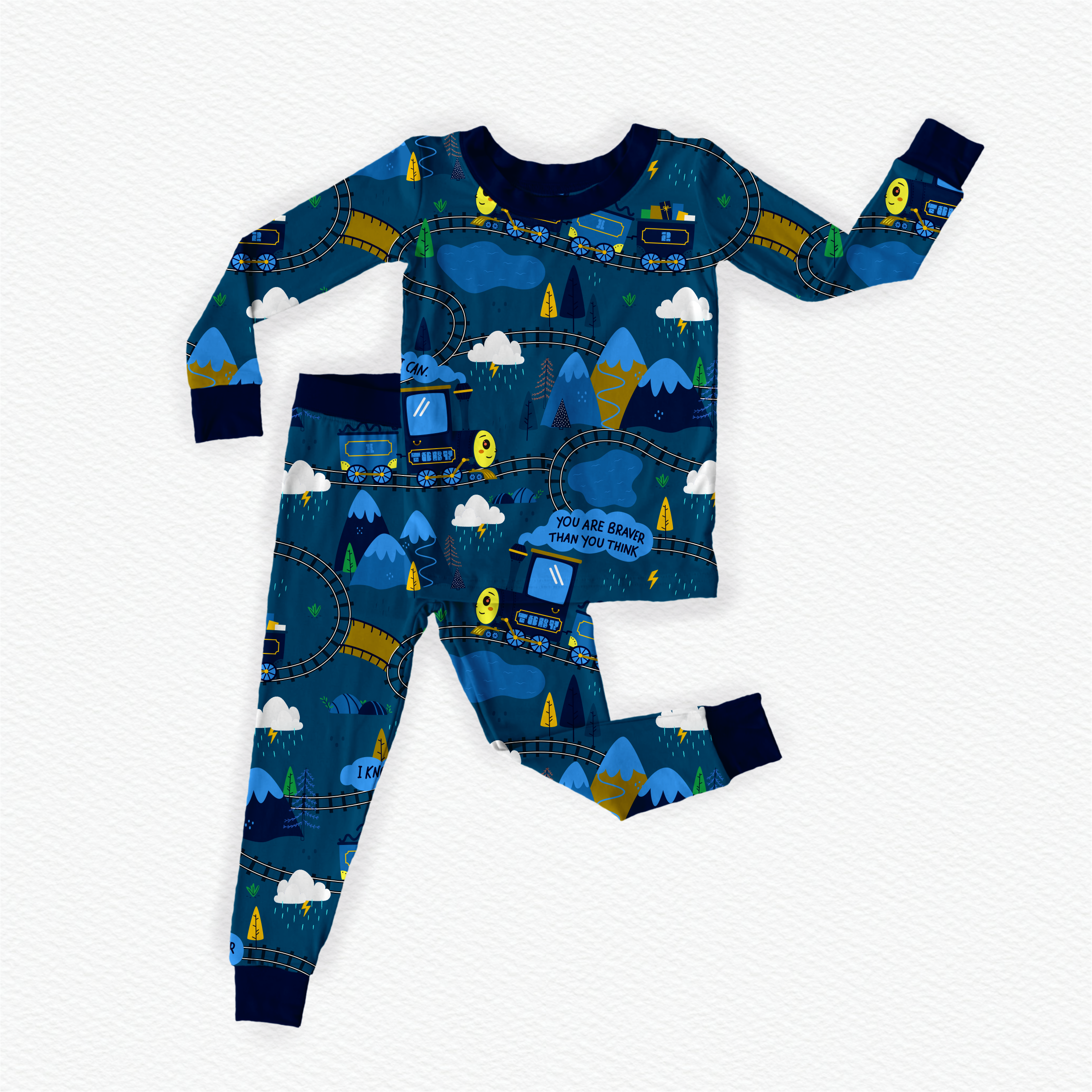 Children's bamboo pajama set with train and mountain design on a blue background
