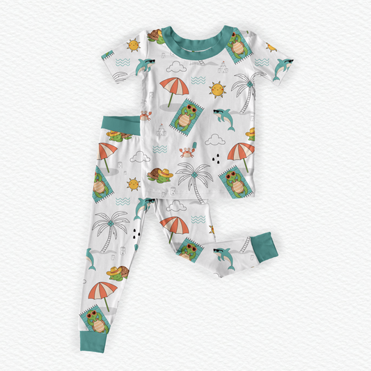 White  short sleeve bamboo kids pajamas featuring Tilly the Tortoise with braille label